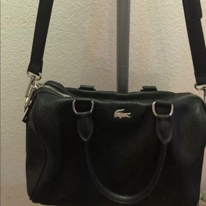 A preowned in perfect condition Lacoste bag